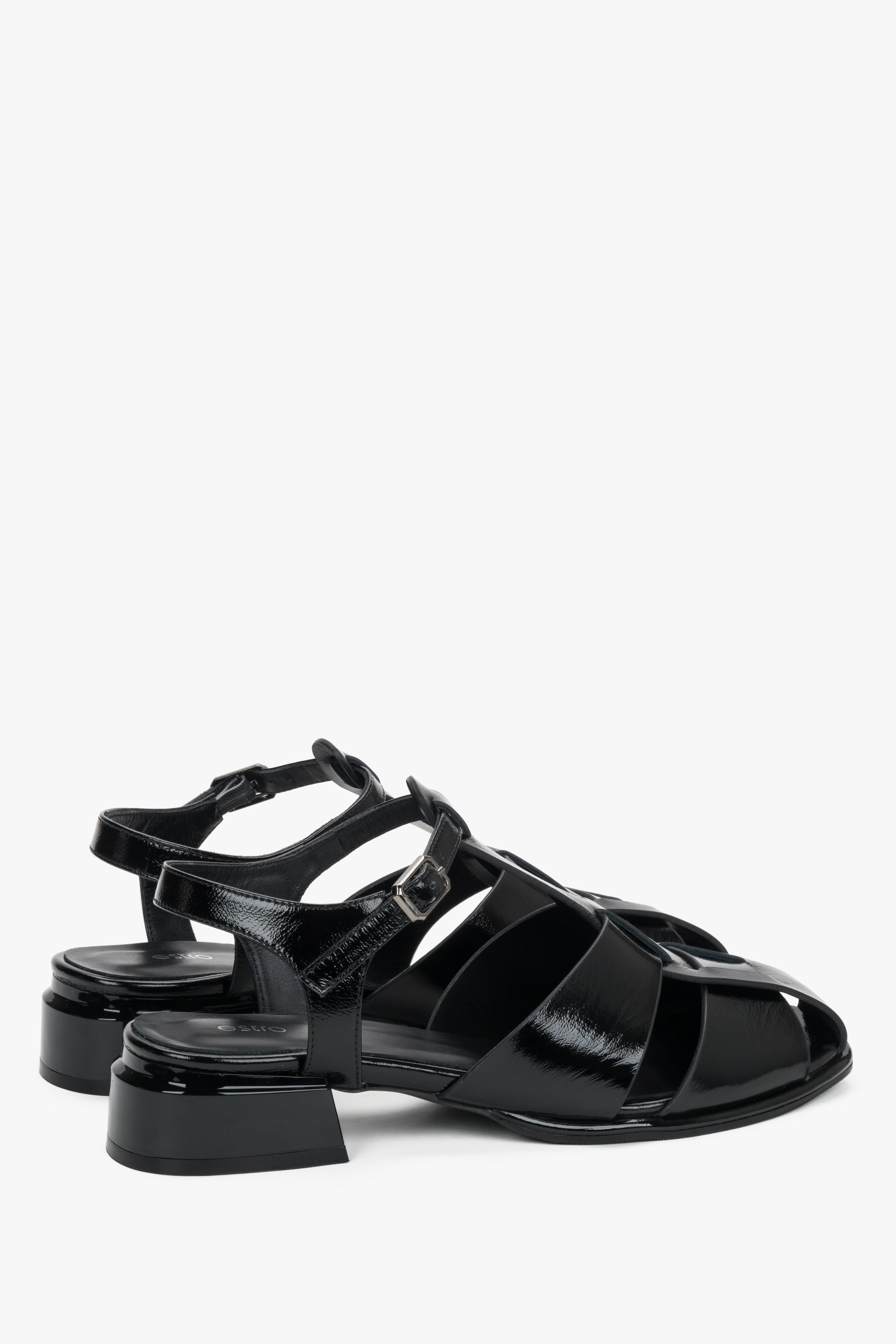 Made of genuine patent leather, women's black sandals on a low block heel Estro.