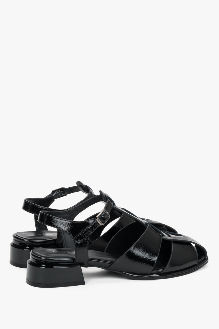 Made of genuine patent leather, women's black sandals on a low block heel Estro.