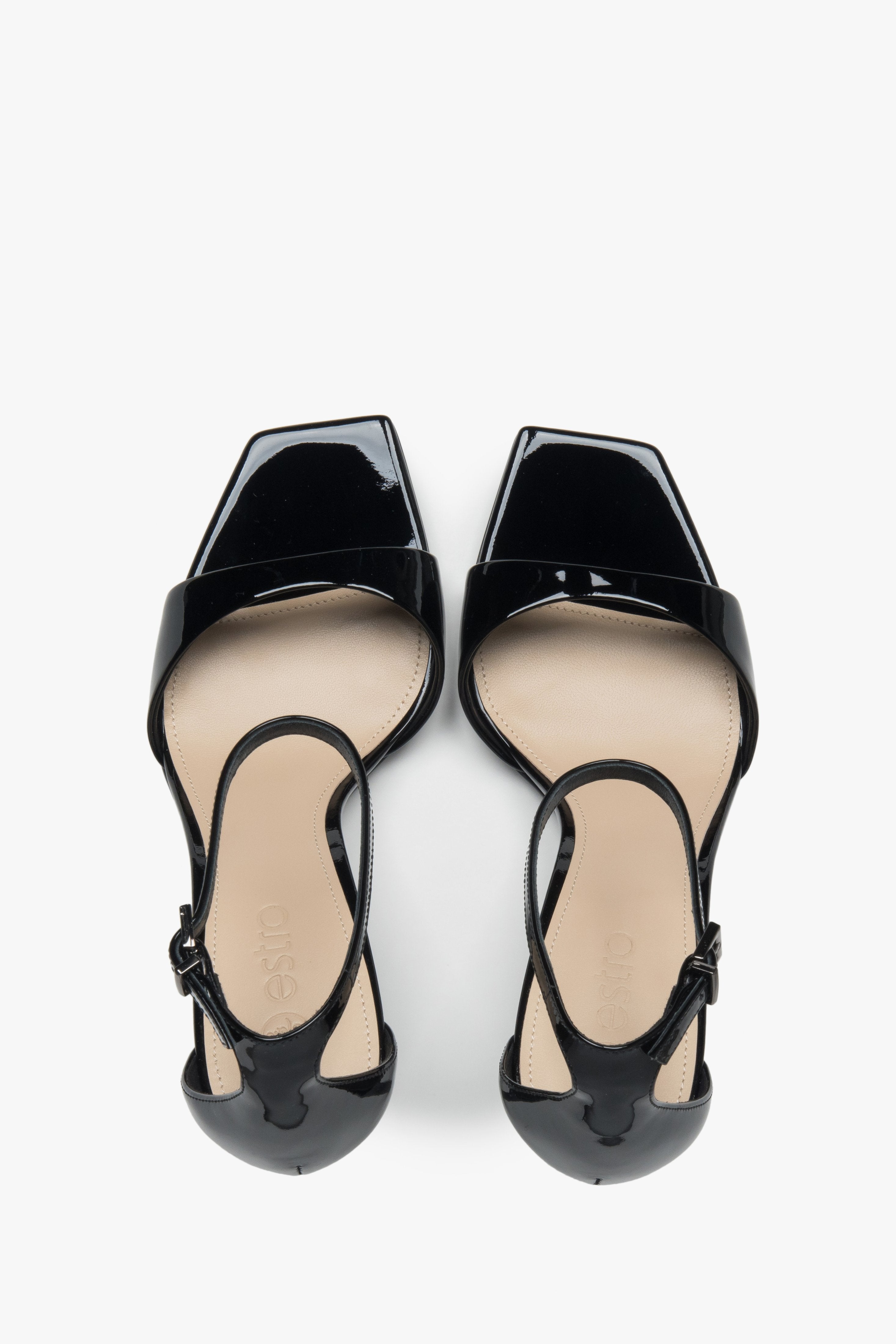 Made of patent natural leather, women’s black sandals on a stable block heel Estro.
