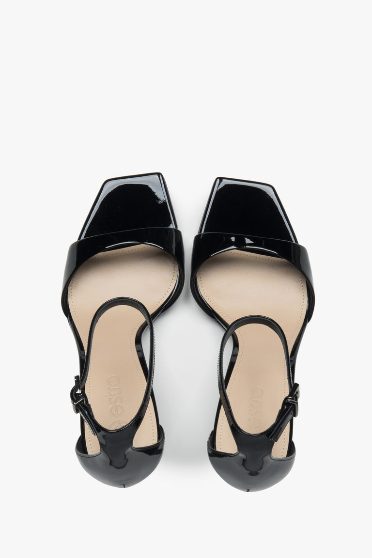 Made of patent natural leather, women’s black sandals on a stable block heel Estro.
