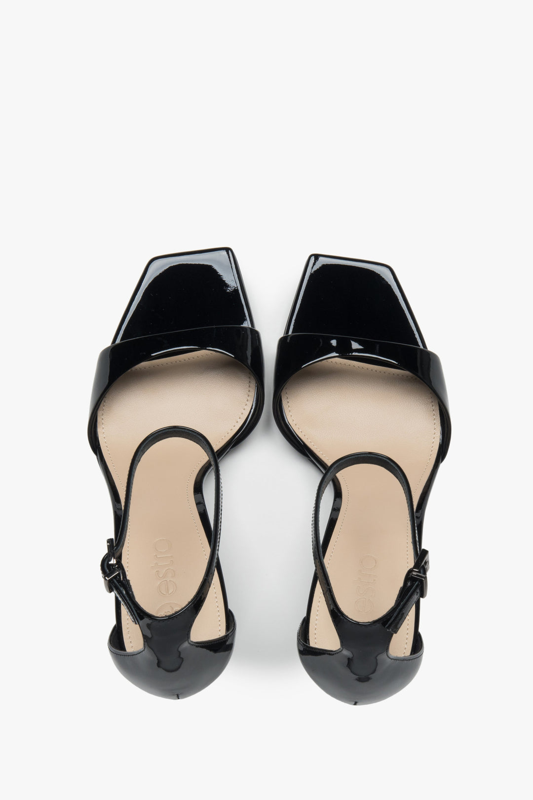 Made of patent natural leather, women’s black sandals on a stable block heel Estro.