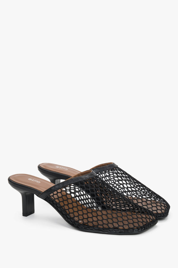 Women’s black openwork mule-style slip-on sandals on a stable stiletto heel.