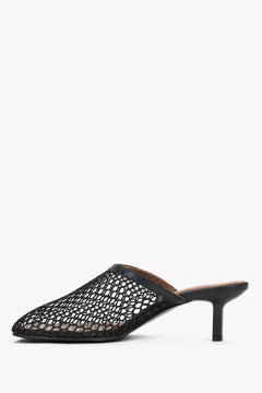 Women’s black openwork mule-style slip-on sandals by Estro on a stable stiletto heel – side view.