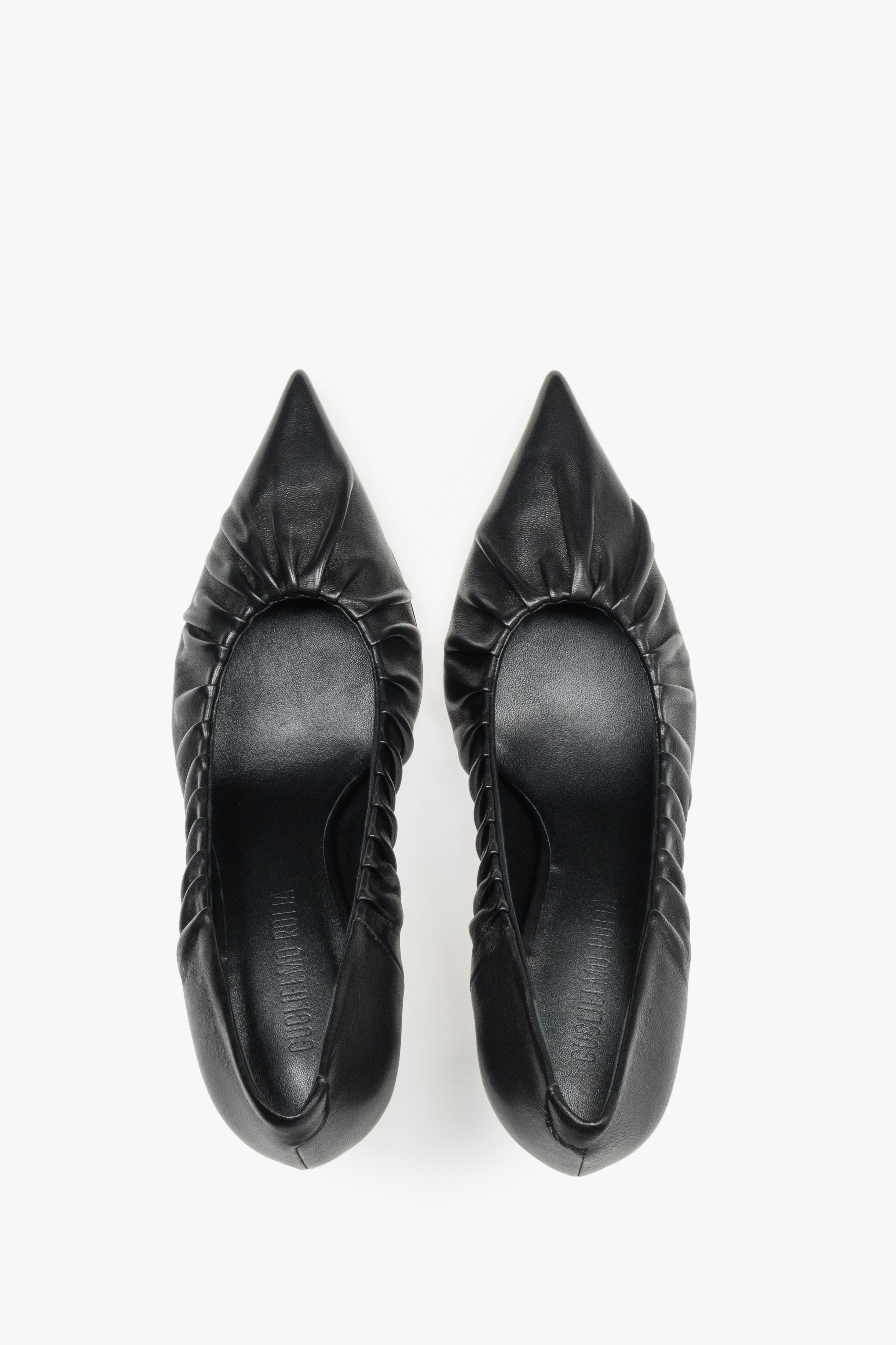 Luxury handcrafted Italian heels featuring a gathered upper detail and leather interior.