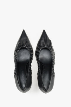 Luxury handcrafted Italian heels featuring a gathered upper detail and leather interior.