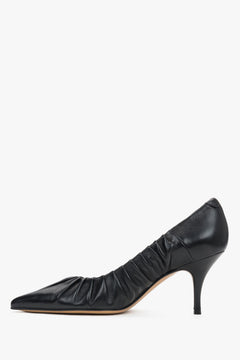 Close-up of the artisanal gathered leather edge and pointed-toe design on luxury pumps.