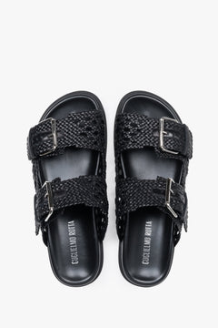 Close-up of the perforated texture and premium finish on Guglielmo Rotta black leather slides.