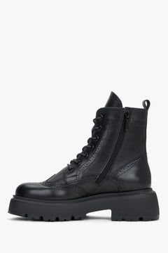 Women's black leather ankle boots Estro - side profile view highlighting the sleek silhouette, heel, and side zipper closure.