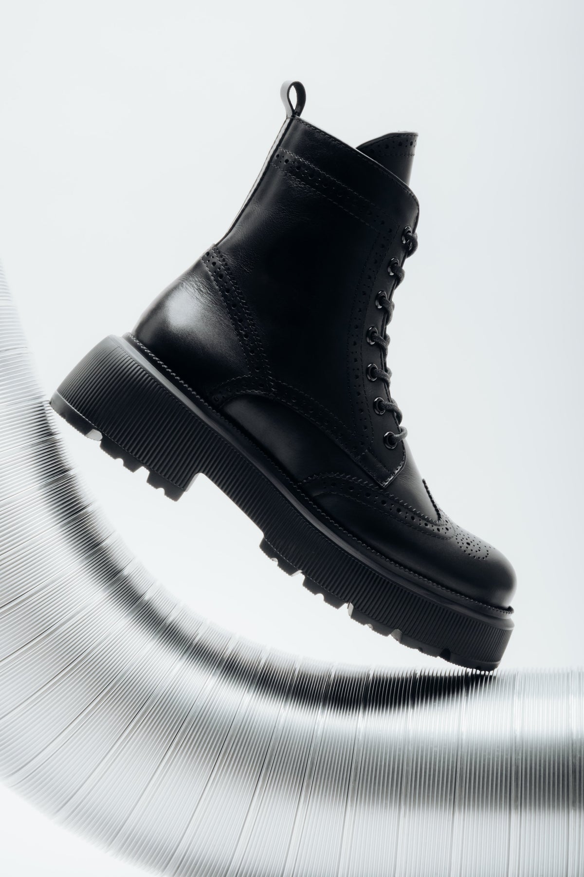 Women's black premium Italian genuine leather ankle boots with folk perforations Estro.