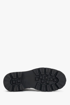 Black natural leather ankle boots featuring folk-style laser perforation details, Estro.