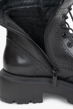 Women's black genuine leather boots Estro - close-up view focusing on the intricate folk perforations and premium leather texture.