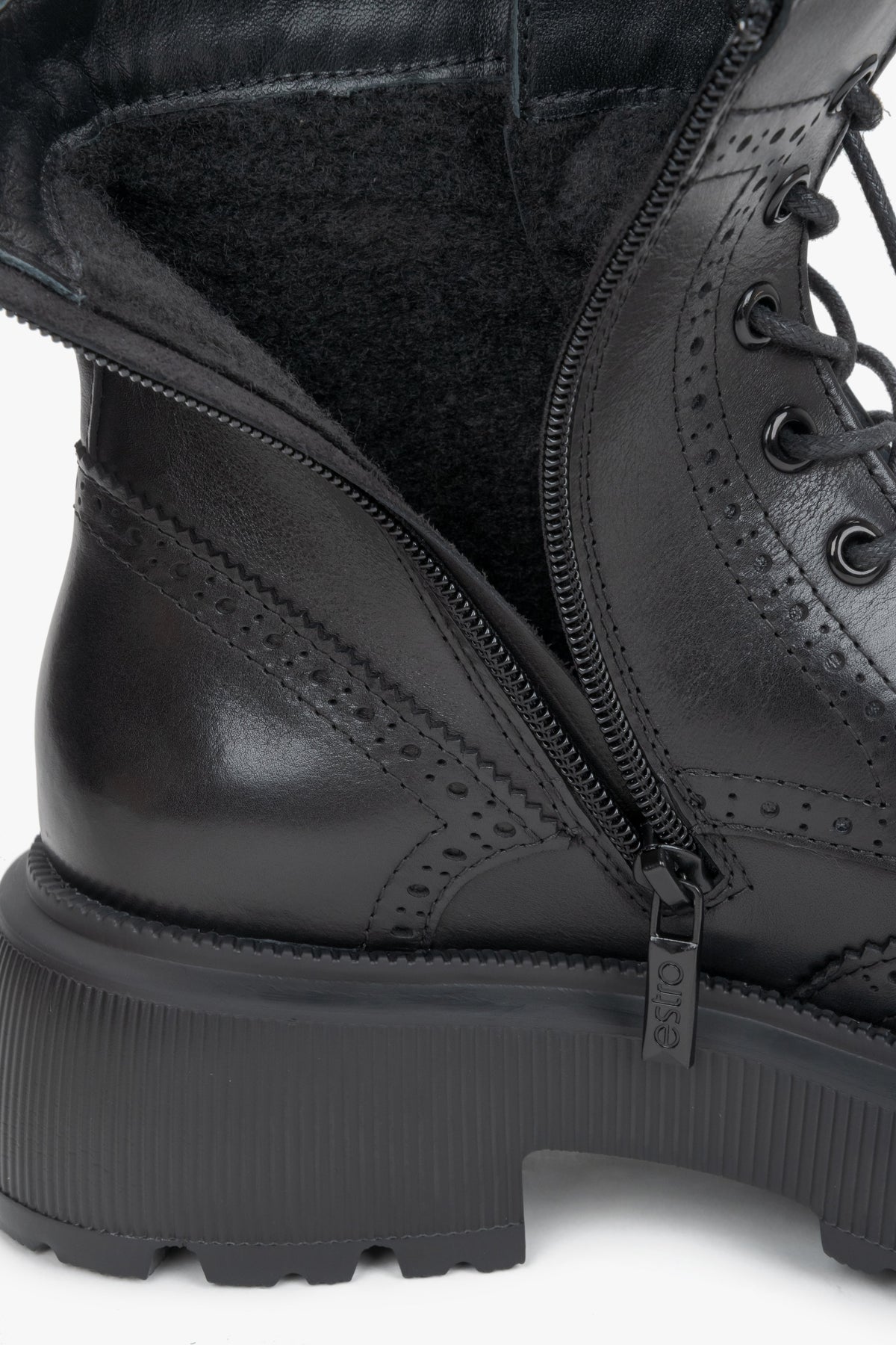 Women's black genuine leather boots Estro - close-up view focusing on the intricate folk perforations and premium leather texture.