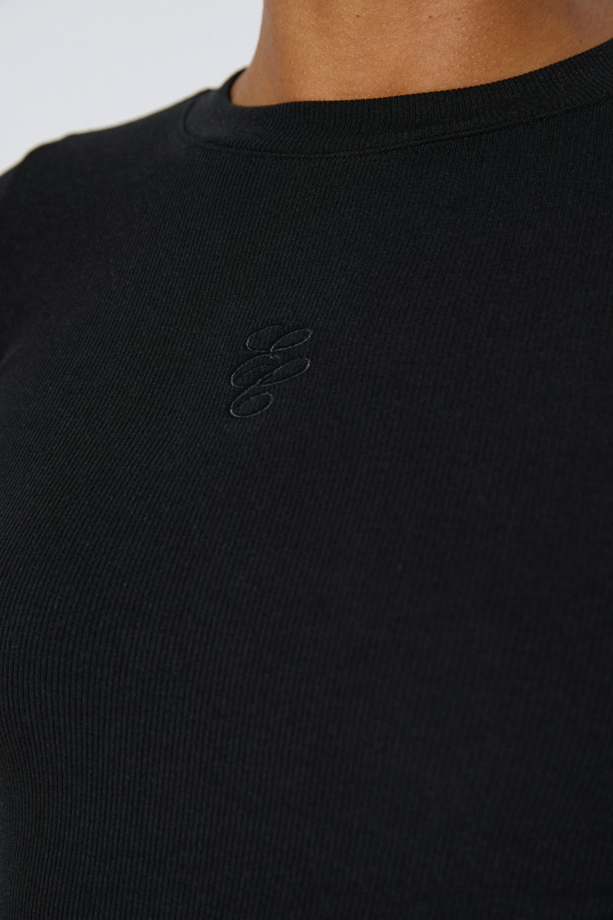 Women's black ribbed long-sleeve top in cotton and viscose by Estro Club.