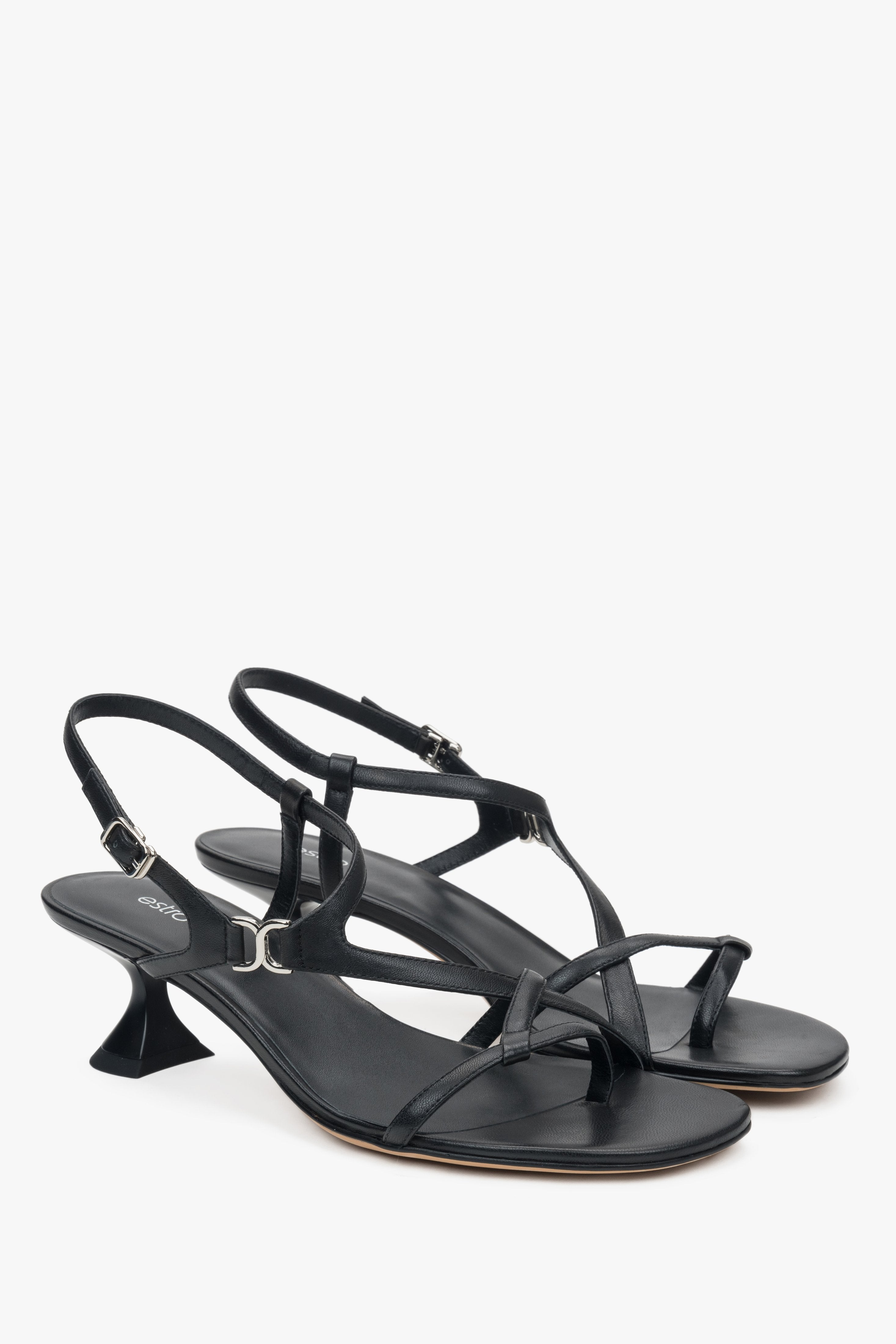 Black women’s sandals with a funnel heel and woven straps.