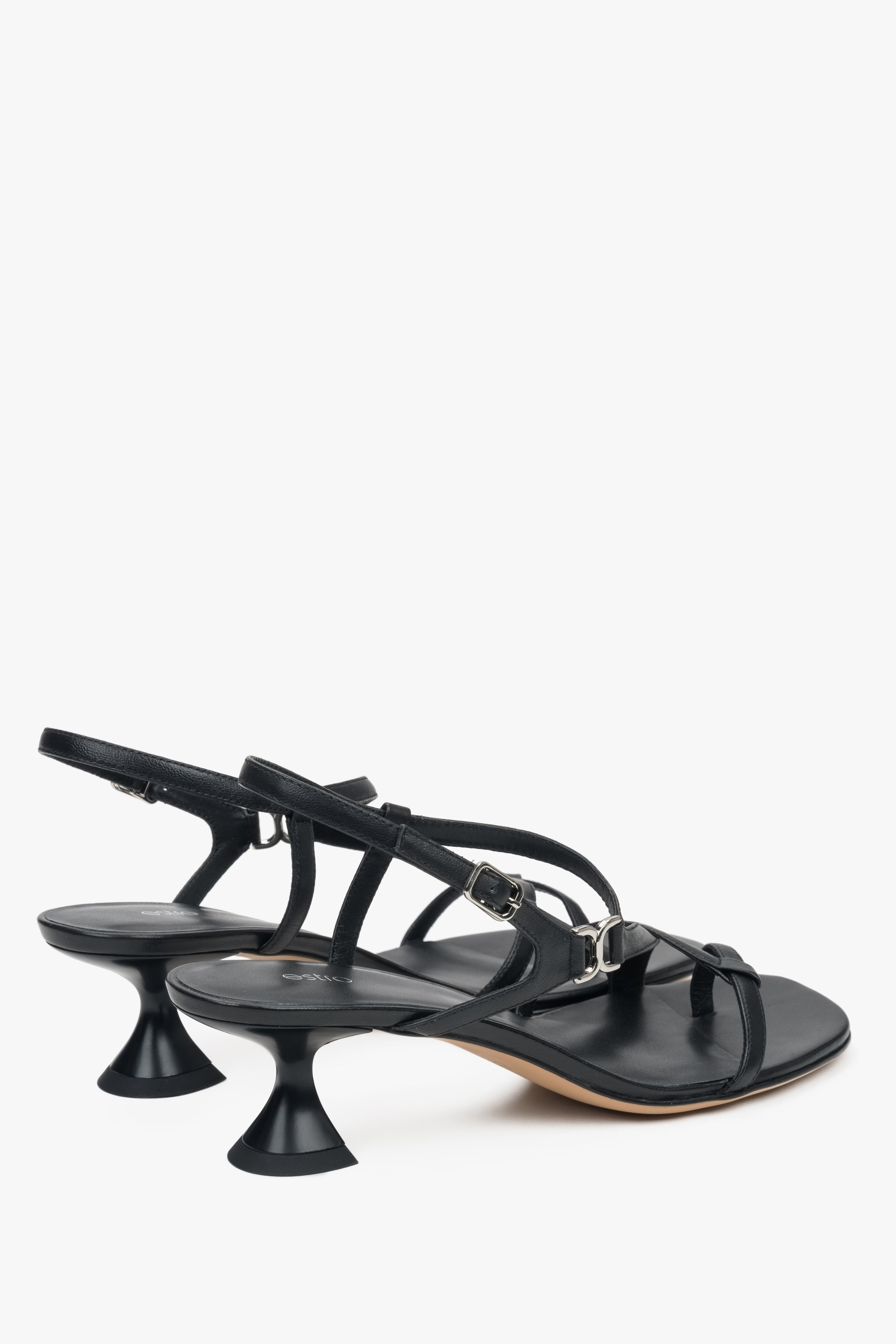 Made of woven straps, black women’s sandals with a funnel heel Estro.