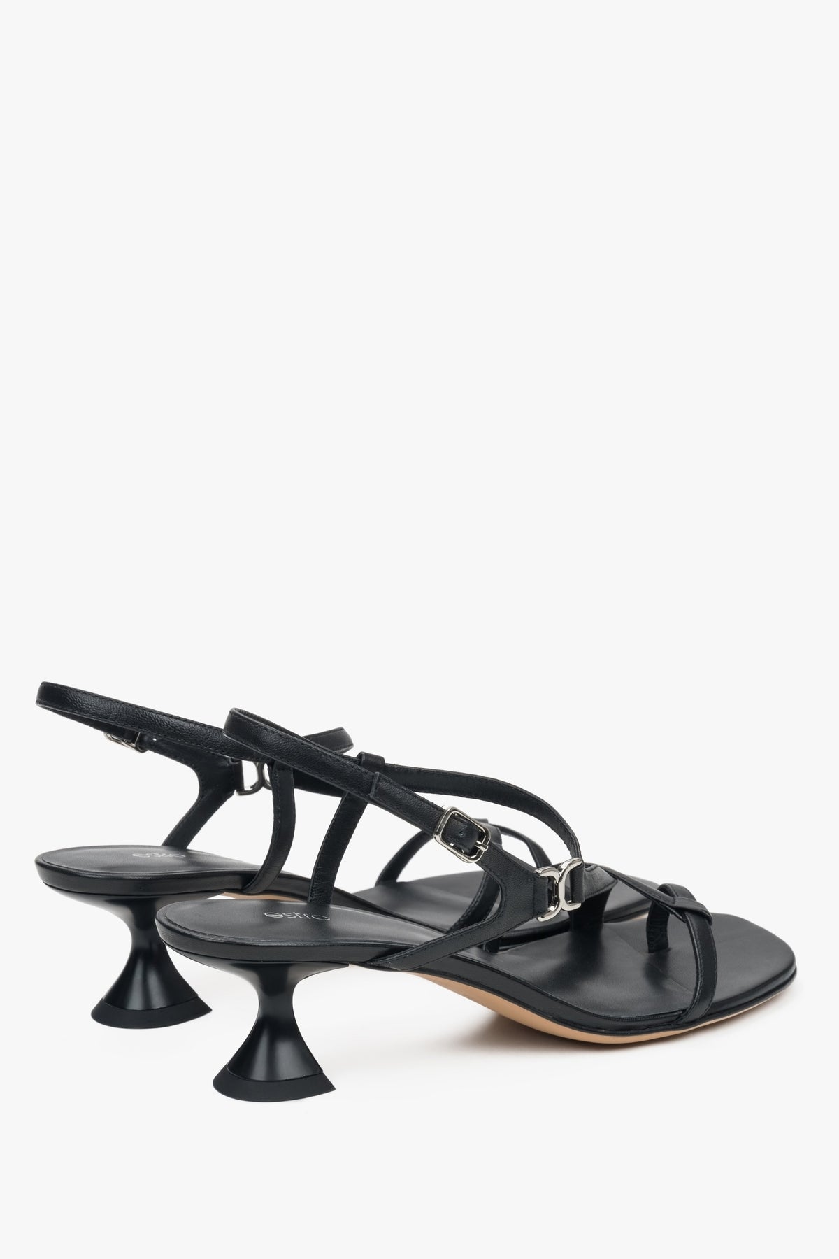 Made of woven straps, black women’s sandals with a funnel heel Estro.