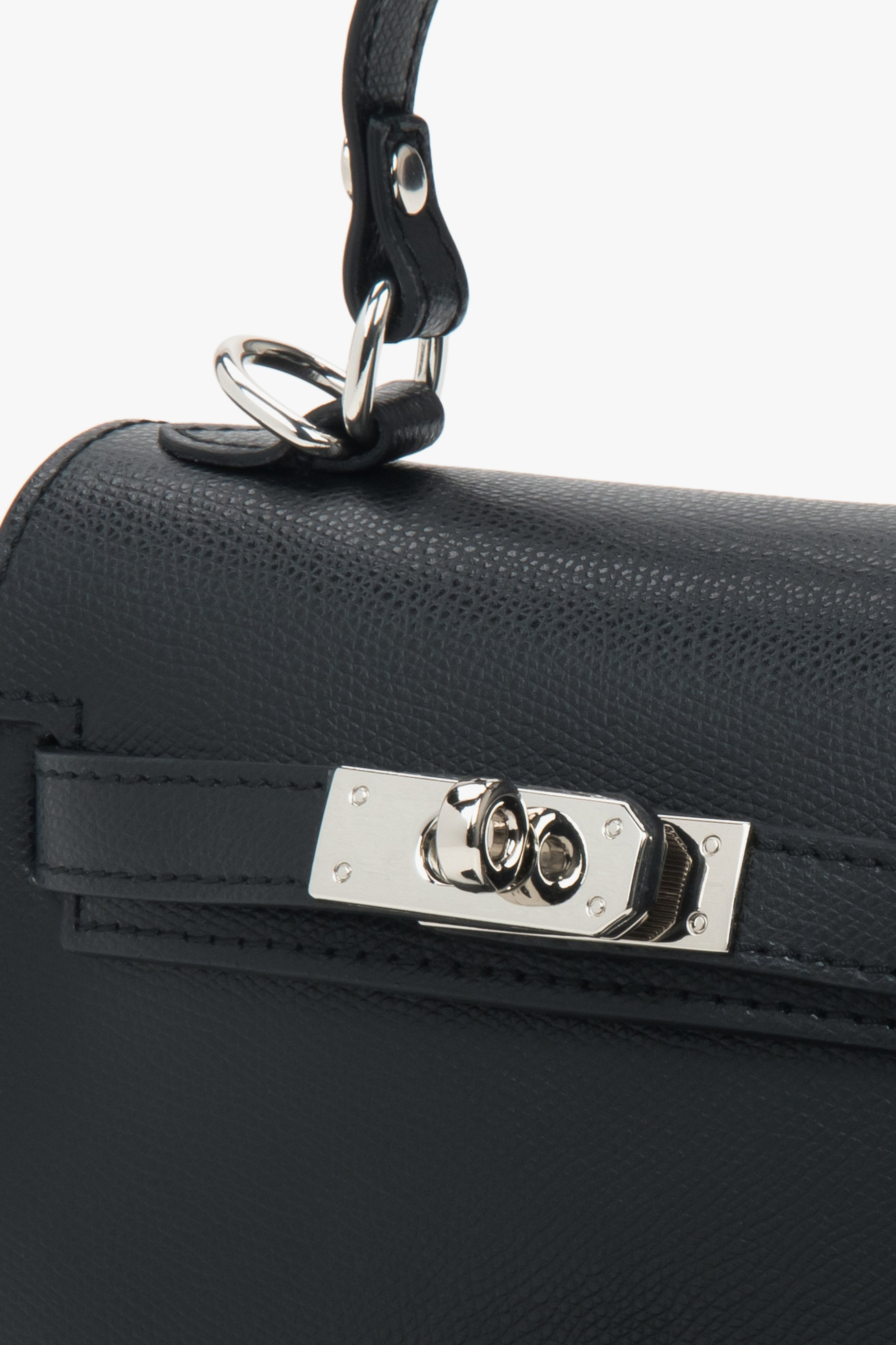 Black leather satchel bag by Estro with silver accents.
