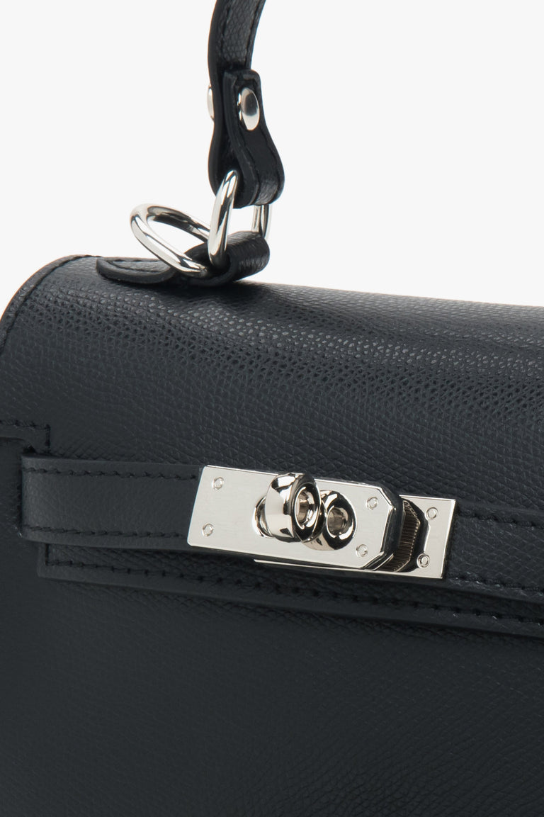 Black leather satchel bag by Estro with silver accents.