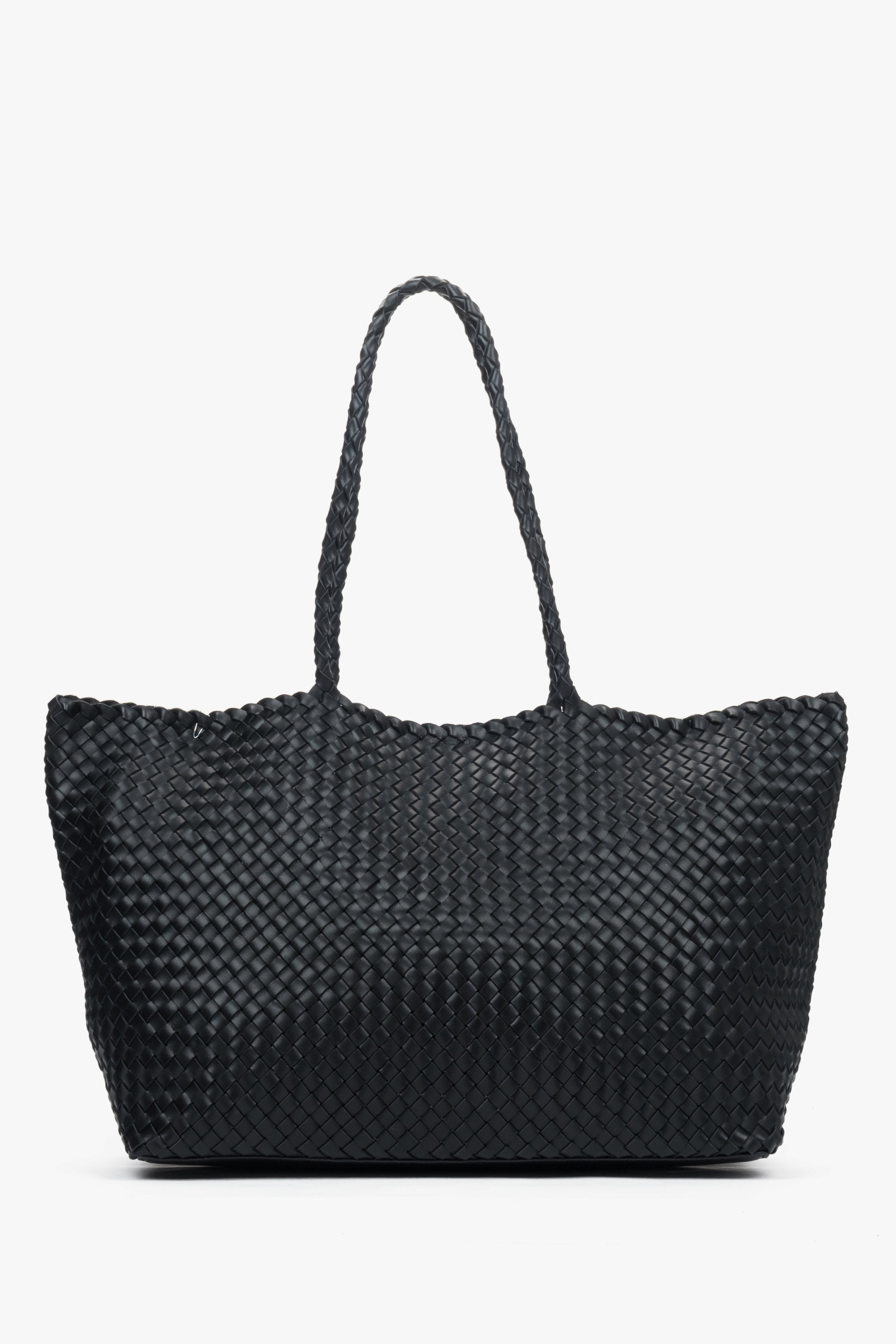 Women’s black shopper bag in woven genuine leather with velour and textile interior.