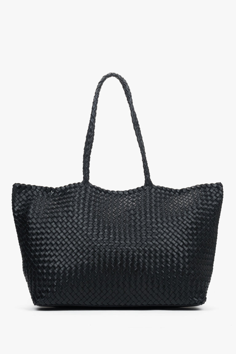 Women’s black shopper bag in woven genuine leather with velour and textile interior.