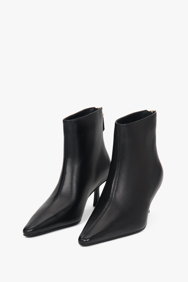 Women’s black, short ankle boots made of genuine leather with a low heel Estro.
