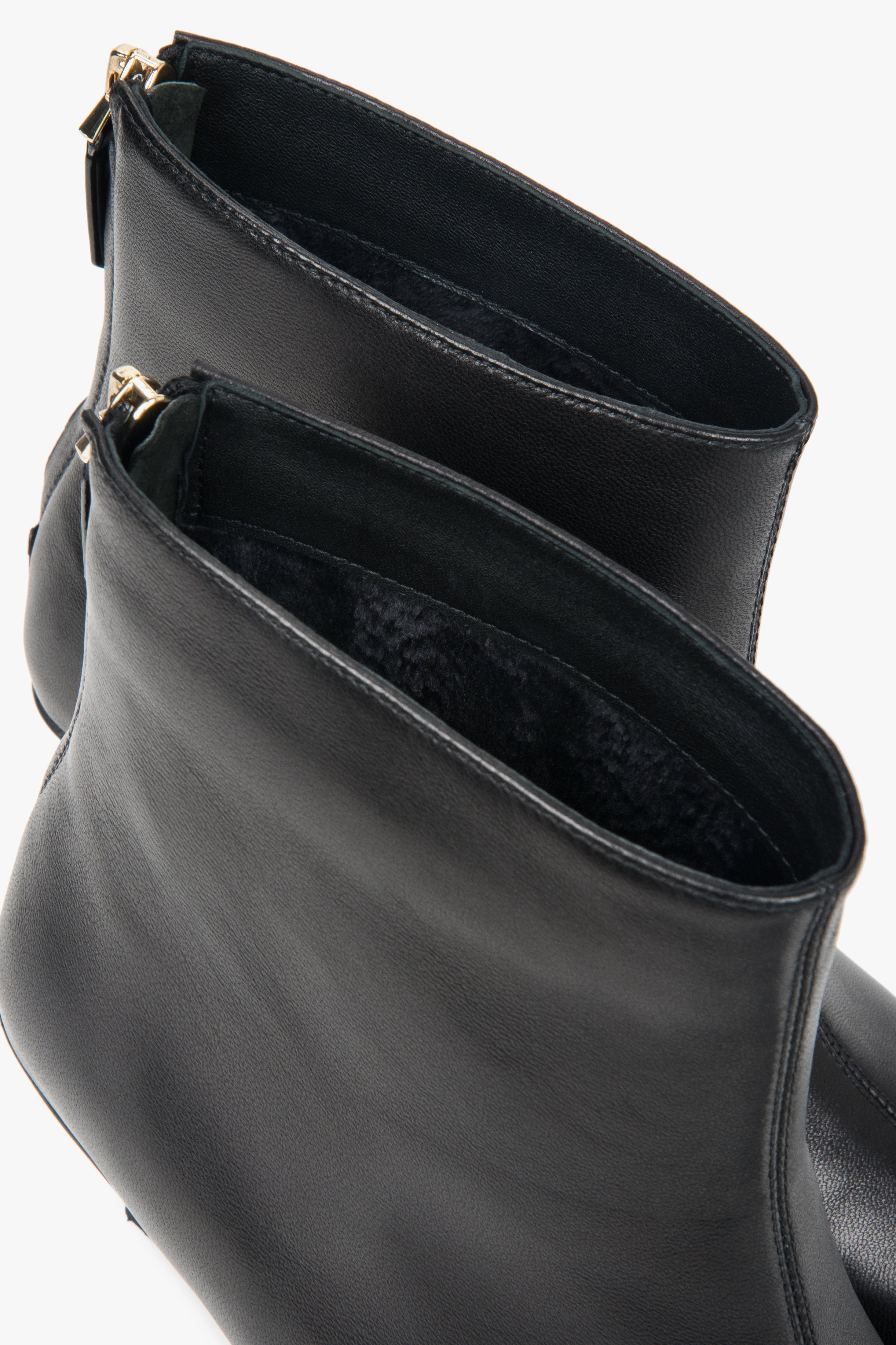Made of genuine leather, black, short women’s ankle boots with a low heel Estro.