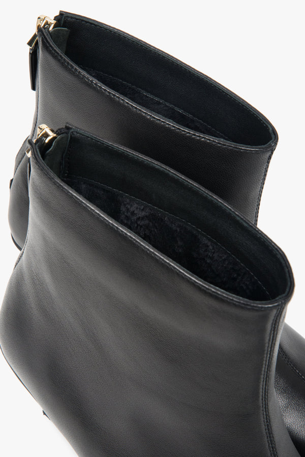 Made of genuine leather, black, short women’s ankle boots with a low heel Estro.