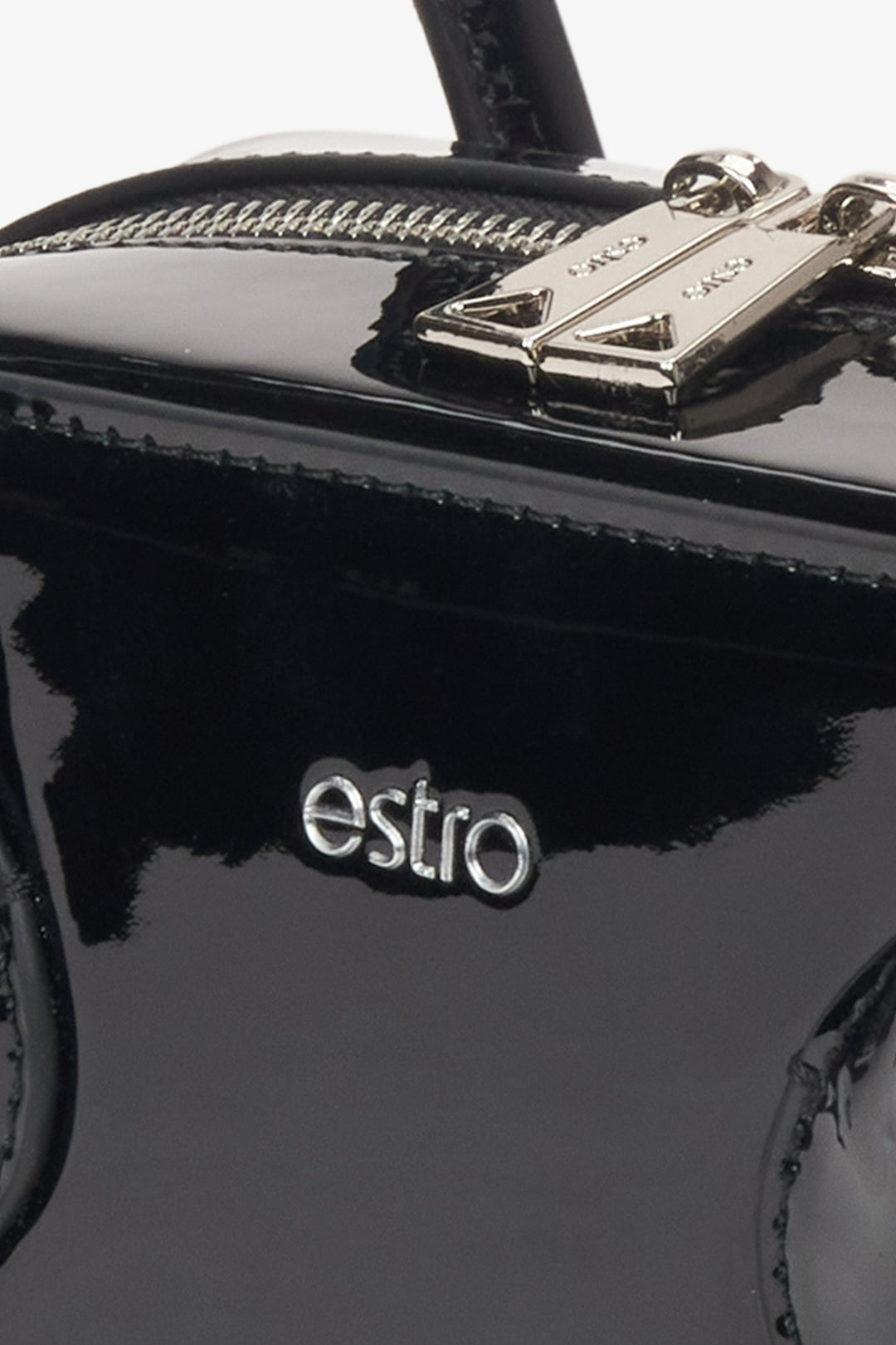 Black shoulder bag for women, made from glossy patent leather, by Estro - details.