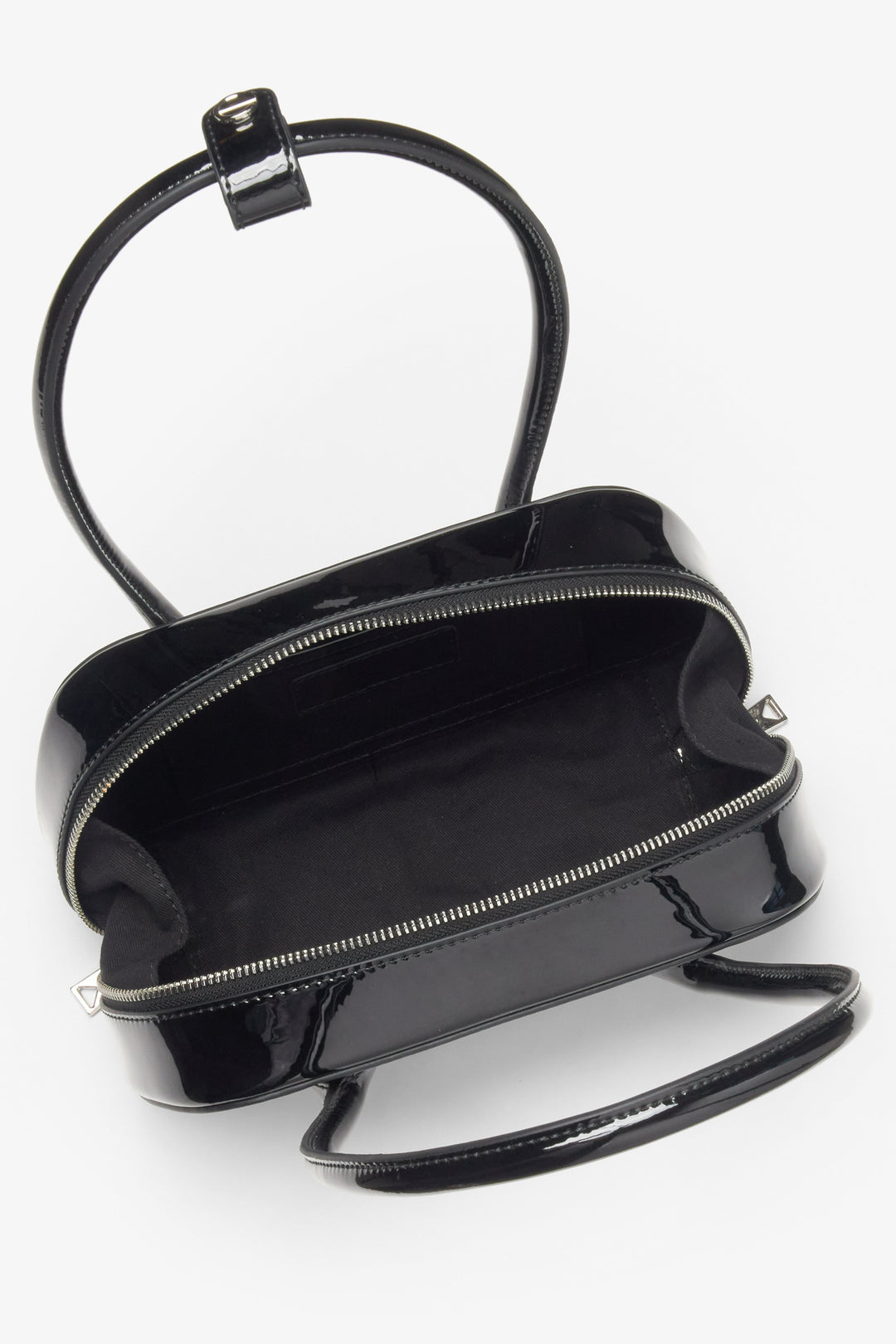 A patent leather shoulder bag in black, designed for women by Estro.