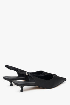 Black slingback women’s pumps with a low heel, made from soft textiles by Estro.