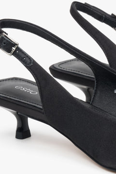 Black slingback women’s pumps with a low heel, made from soft textiles by Estro.