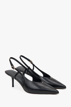 Black women’s slingback pumps with an open heel and a stable stiletto heel.