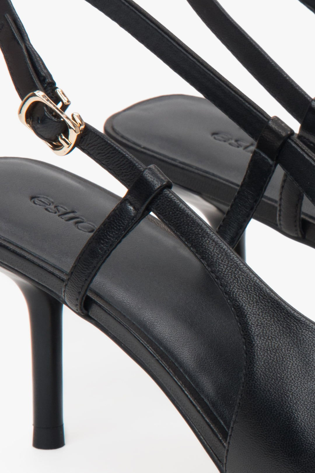 Black women’s Estro slingback pumps with an open heel and a stable stiletto heel.