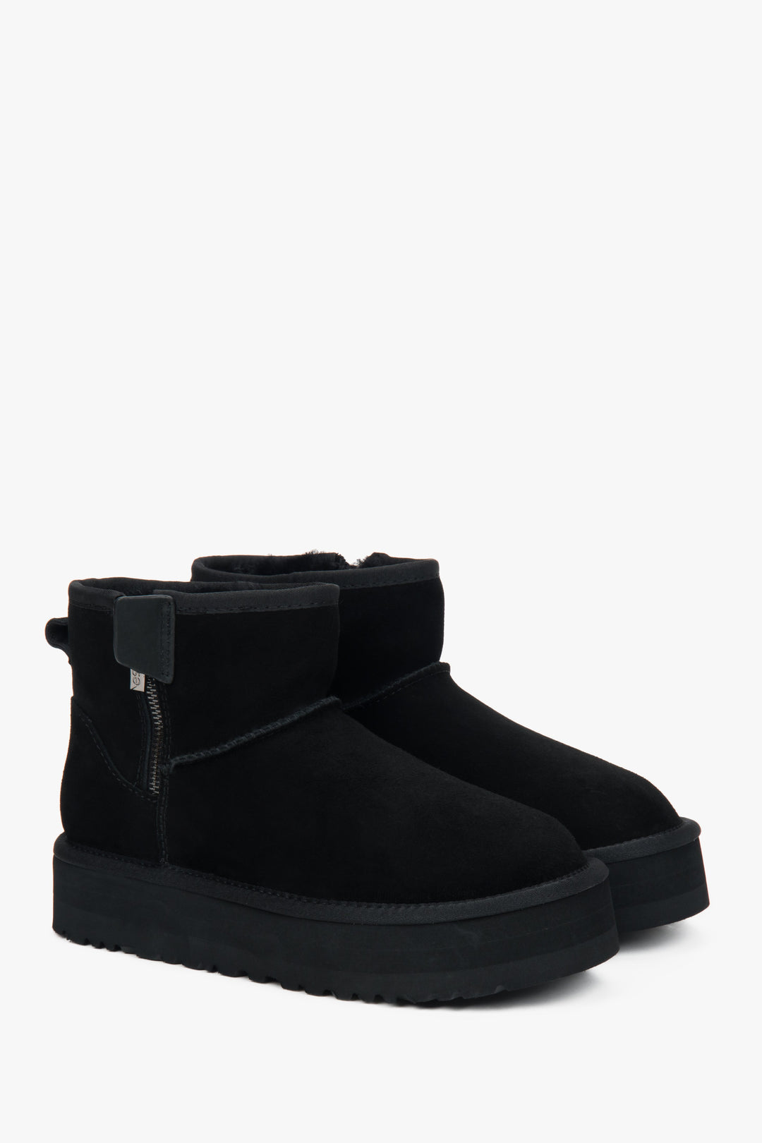 Women's snow boots made of genuine velour, lined with fur, in black.