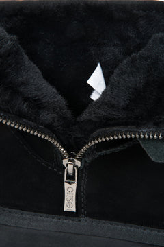 Elegant women's snow boots in black, made of genuine velour with a fur-lined interior.