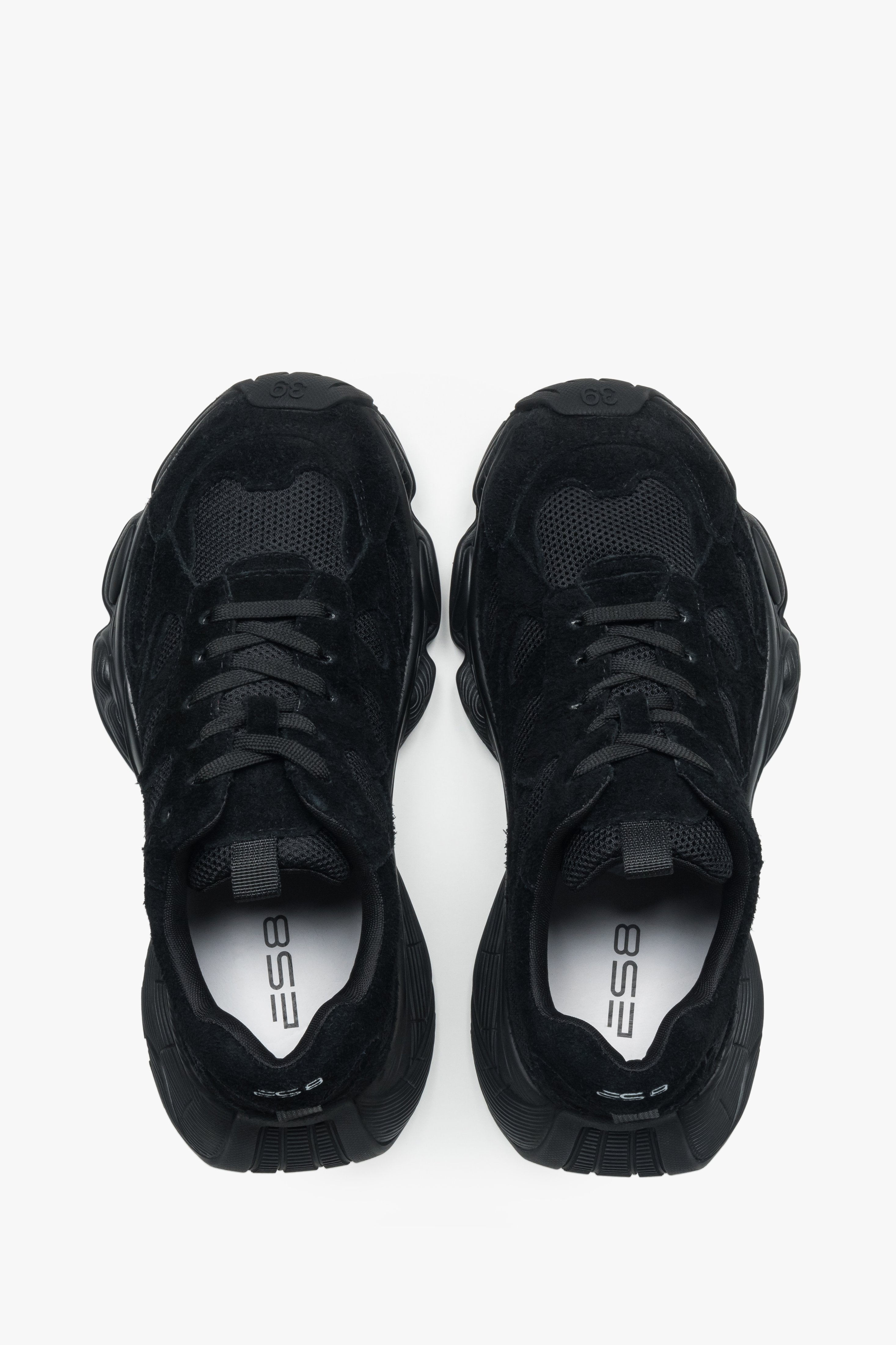 Women's black velour platform sneakers – back view highlighting the stable heel support and geometric sole structure.