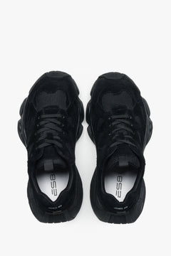 Women's black velour platform sneakers – back view highlighting the stable heel support and geometric sole structure.