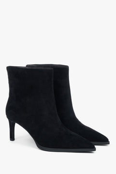 Short, black women’s ankle boots with a stiletto heel made of genuine velour.
