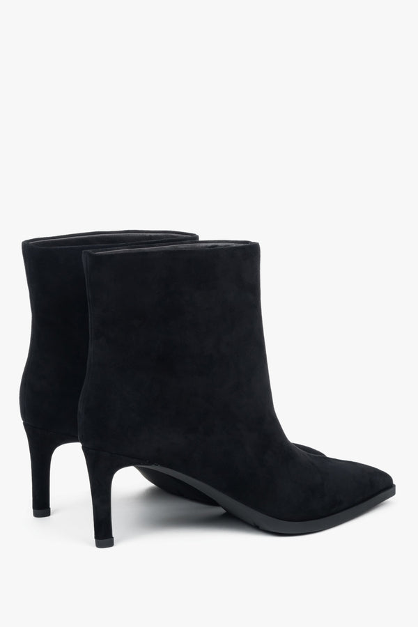 With a stiletto heel, short, black women’s ankle boots made of genuine velour Estro.