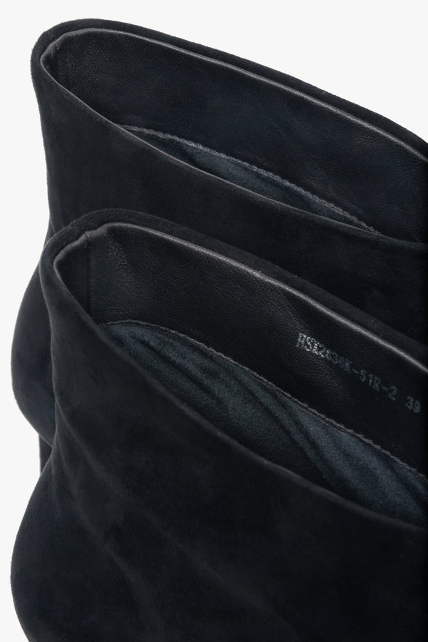 Made of genuine velour, short, black women’s ankle boots with a stiletto heel Estro.