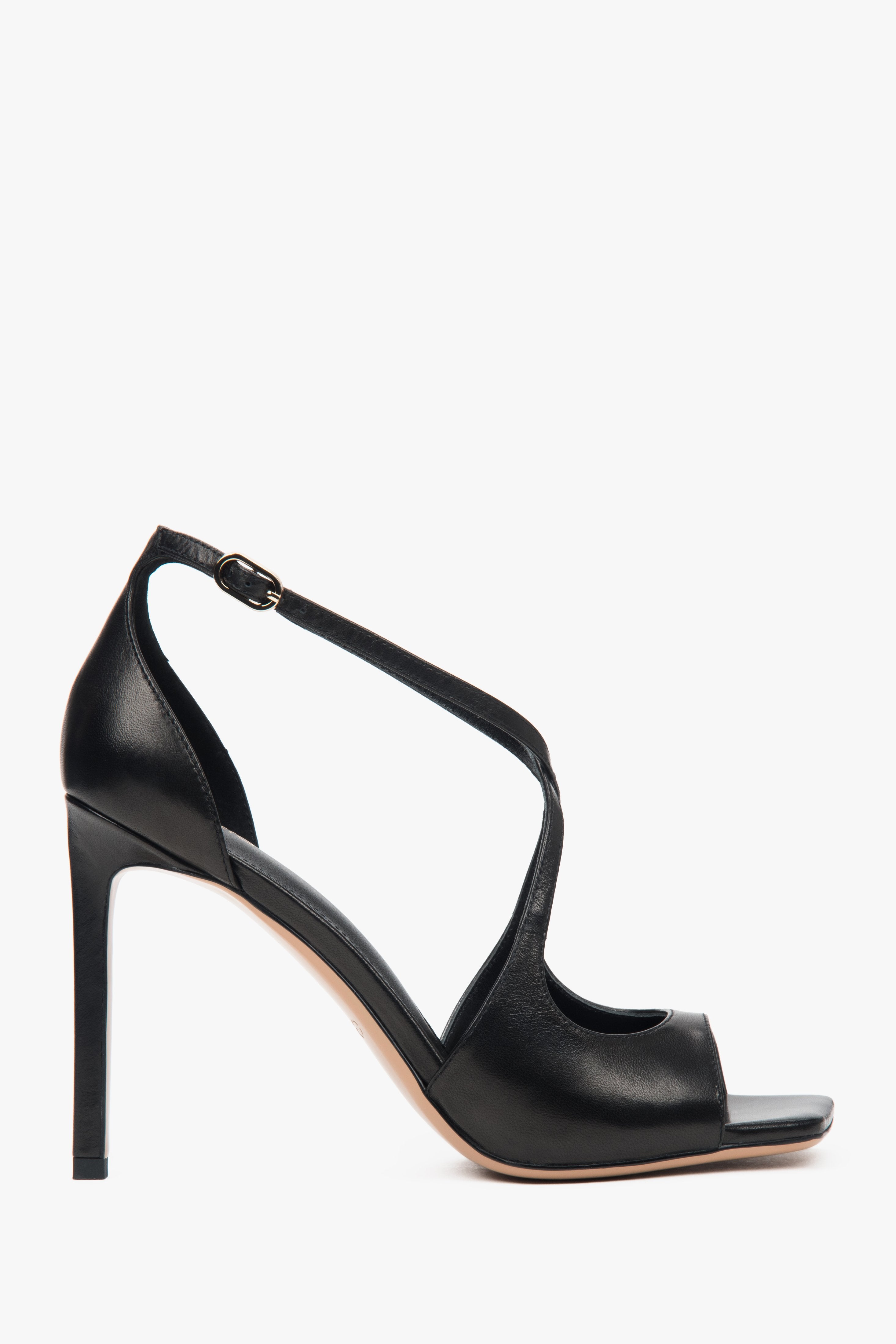 Women’s black stiletto sandals with decorative fastening.