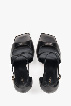 Women’s black stiletto sandals with decorative fastening by Estro – top view.