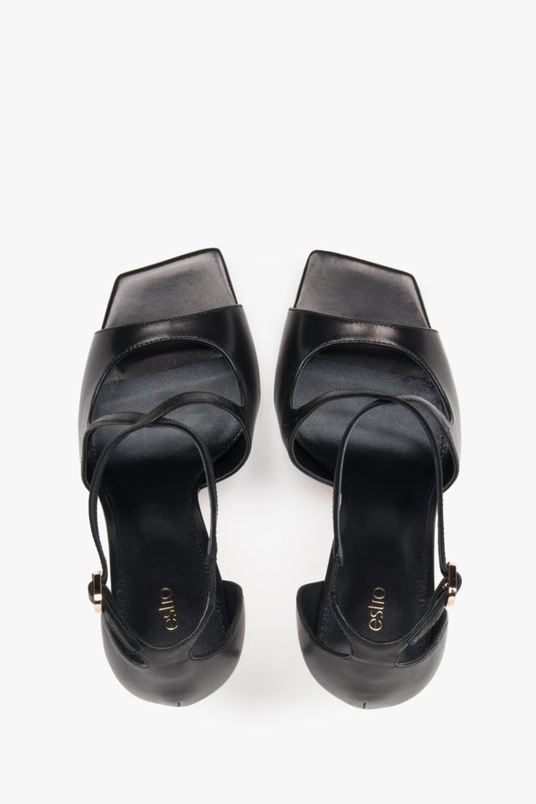 Women’s black stiletto sandals with decorative fastening by Estro – top view.