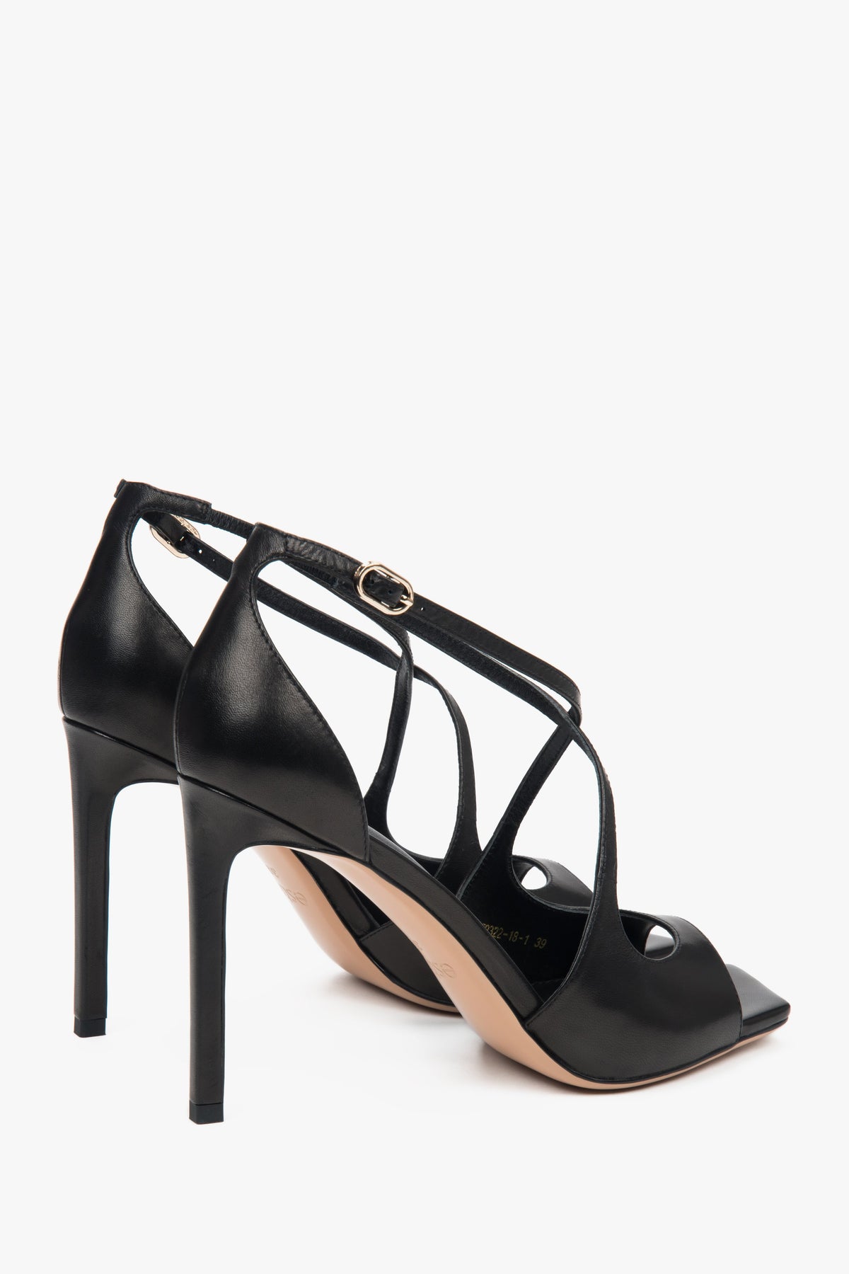 Women’s black stiletto sandals with decorative fastening by Estro.