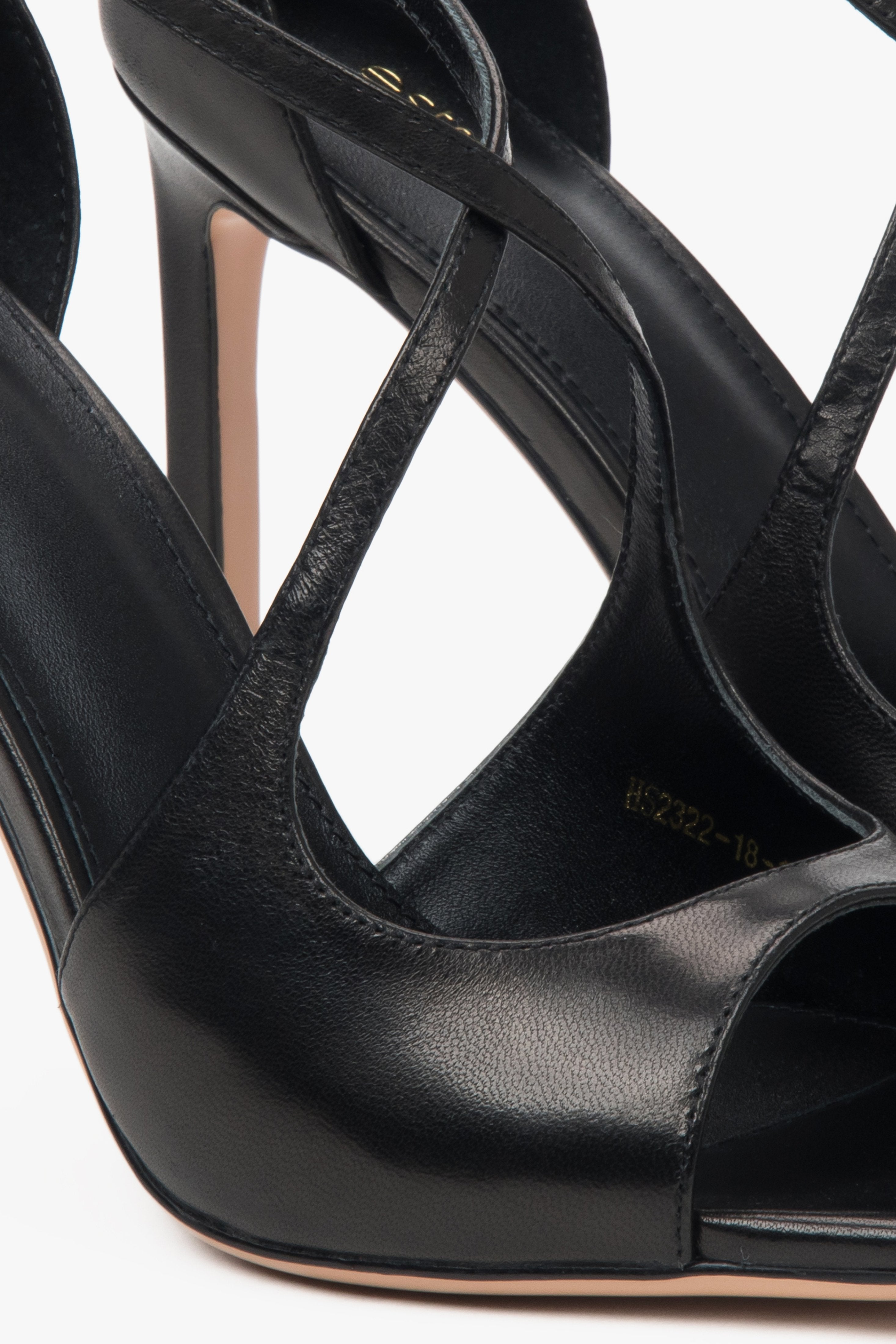 Women’s black stiletto sandals with decorative fastening by Estro.