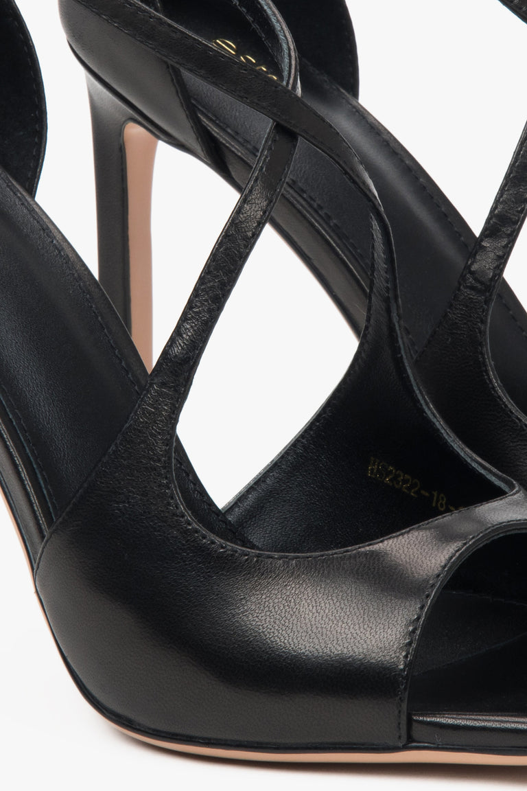 Women’s black stiletto sandals with decorative fastening by Estro.