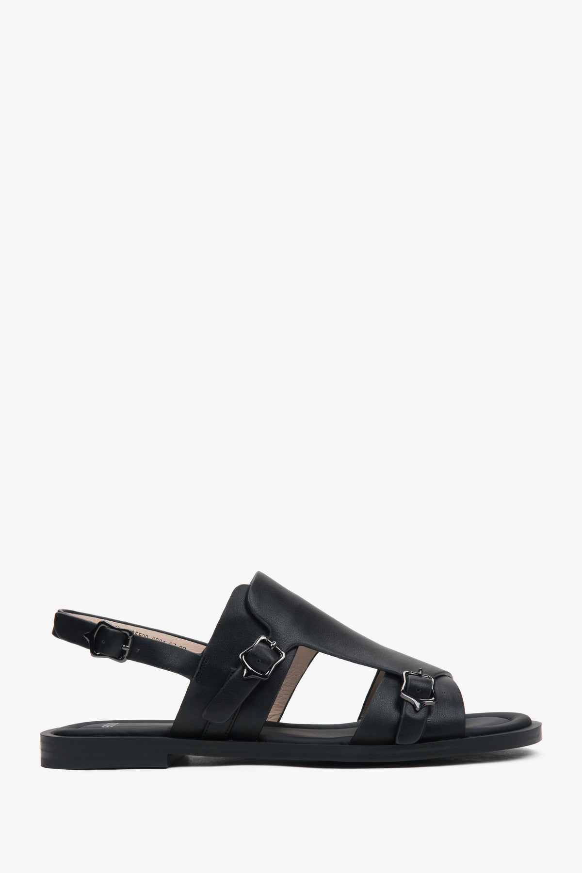 Black closed-toe women’s sandals on a flat natural leather sole.