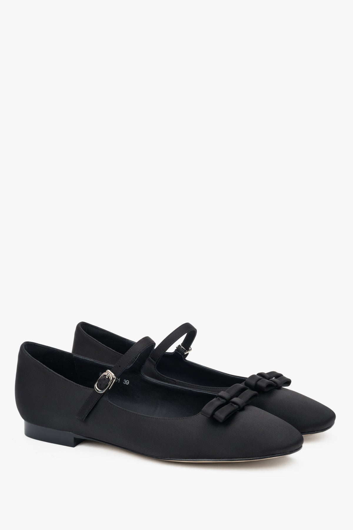 Black textile ballet flats with a buckle.