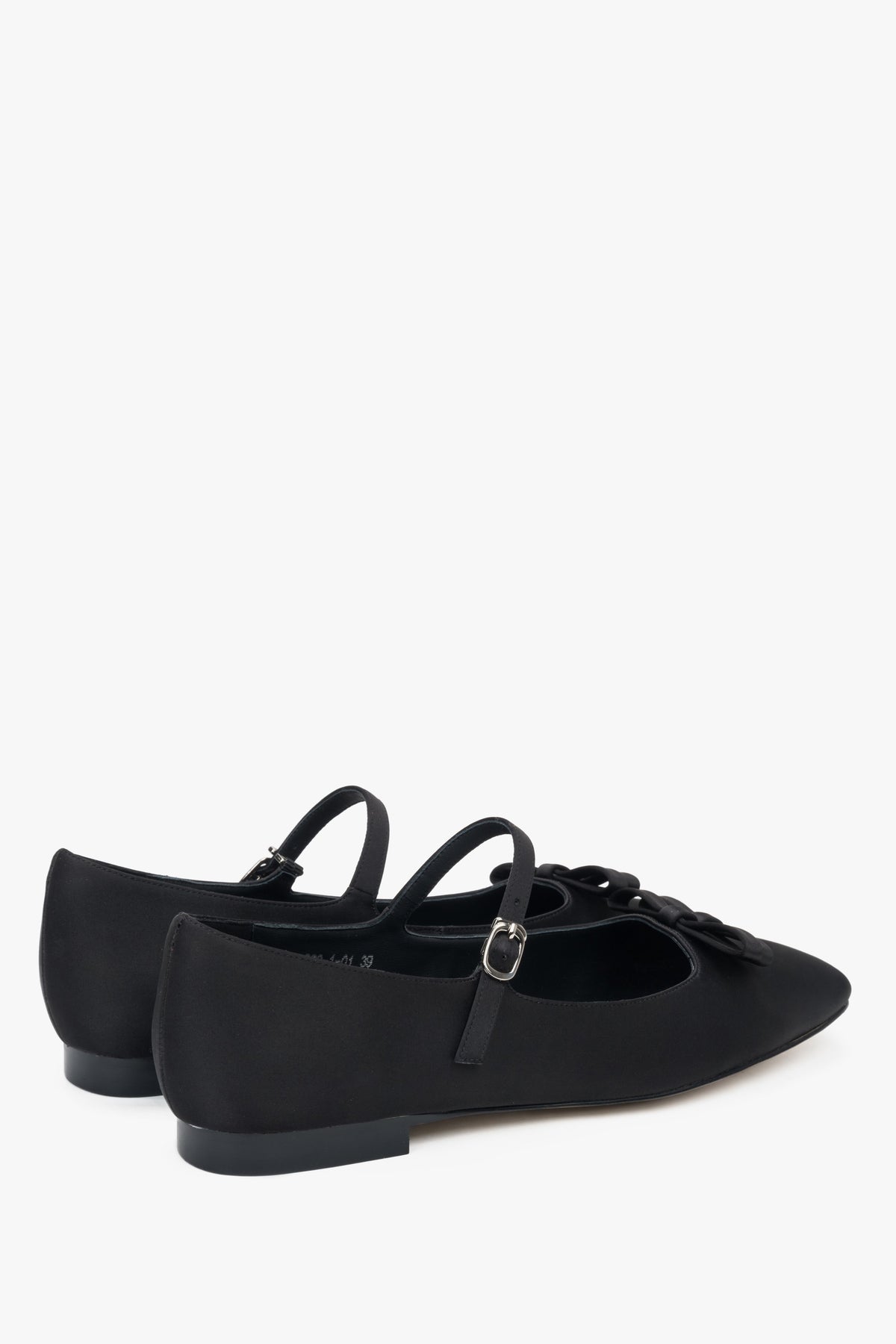 Soft black textile ballet flats with decorative buckle.