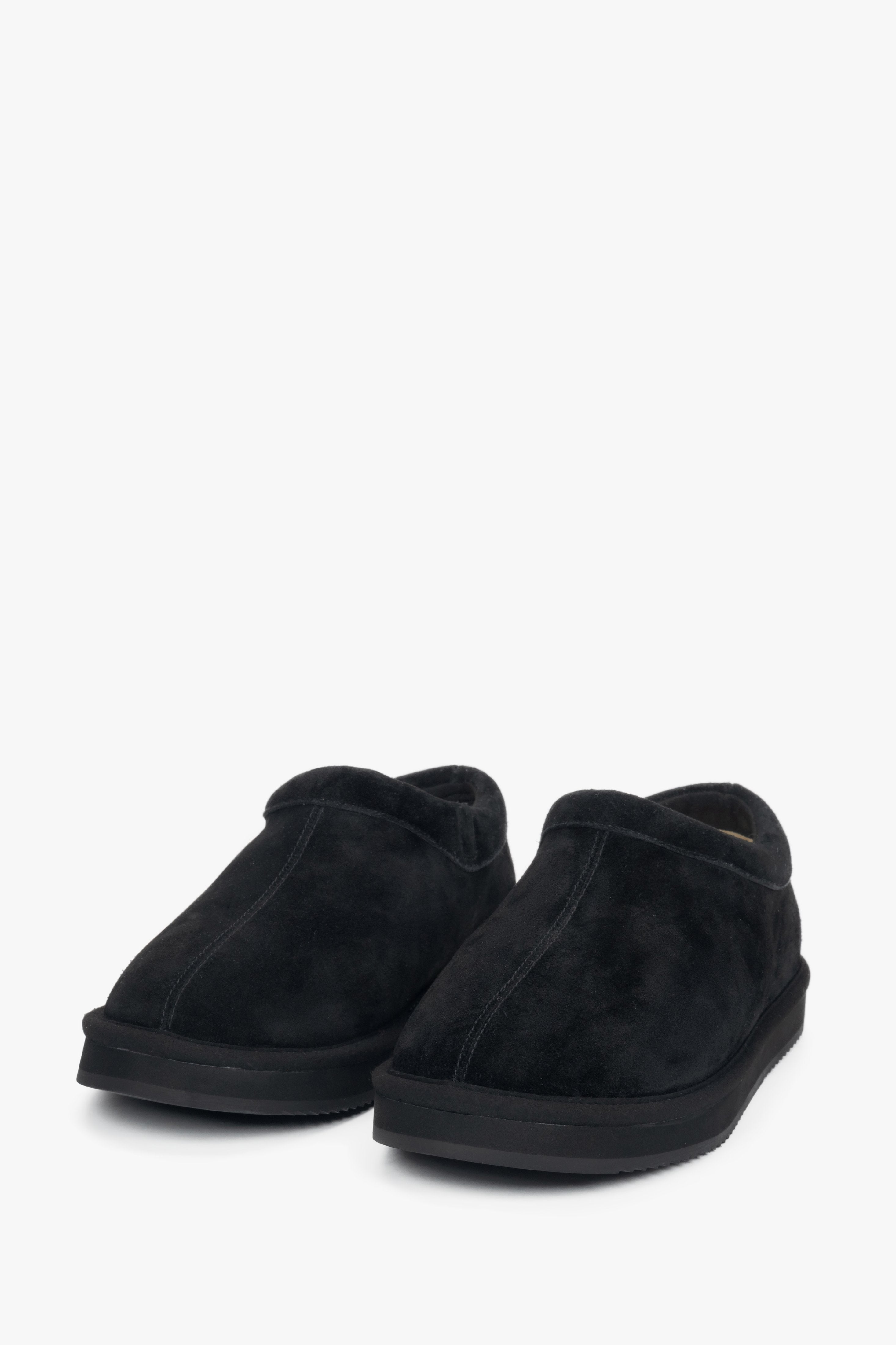 Women's black velour clogs on a flexible platform.